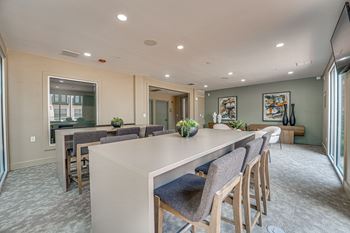 Community room with high top seating and lounge area